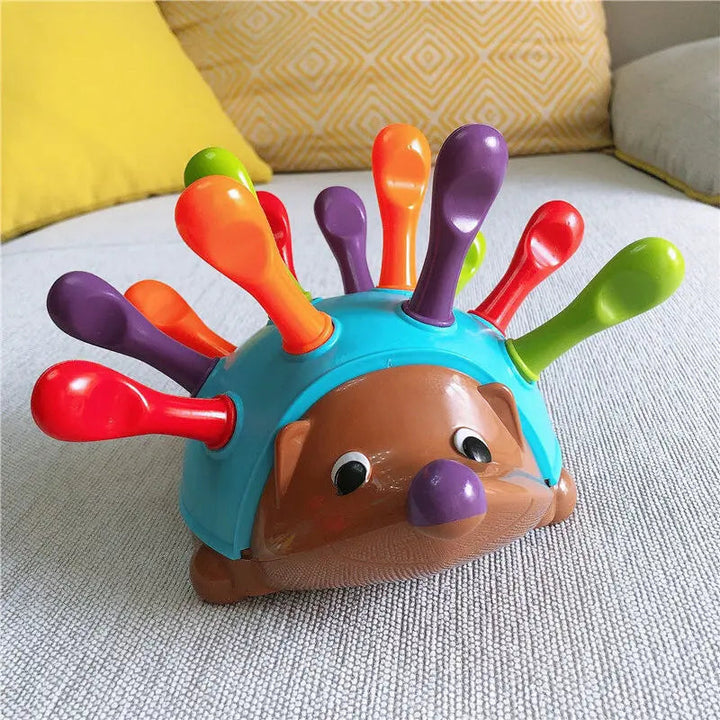 Interactive hedgehog toy for toddlers & preschoolers. BPA-free, develops fine motor skills & encourages early learning.