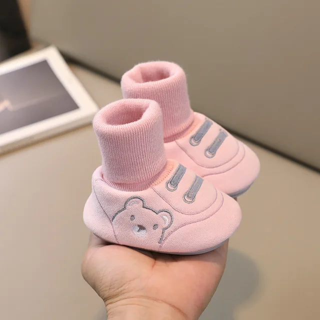 Cute anti-slip socks shoes for toddlers, ideal for first steps. Soft sole infant footwear for comfortable boys & girls.