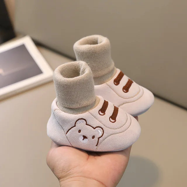Safe anti-slip baby socks shoes for toddlers' first steps. Soft-sole infant footwear, perfect for indoor comfort.