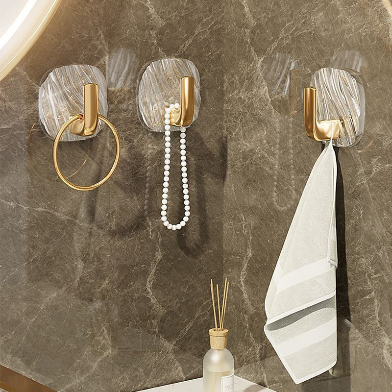 Clear adhesive wall hooks, offering a discreet and strong solution for home and kitchen storage.