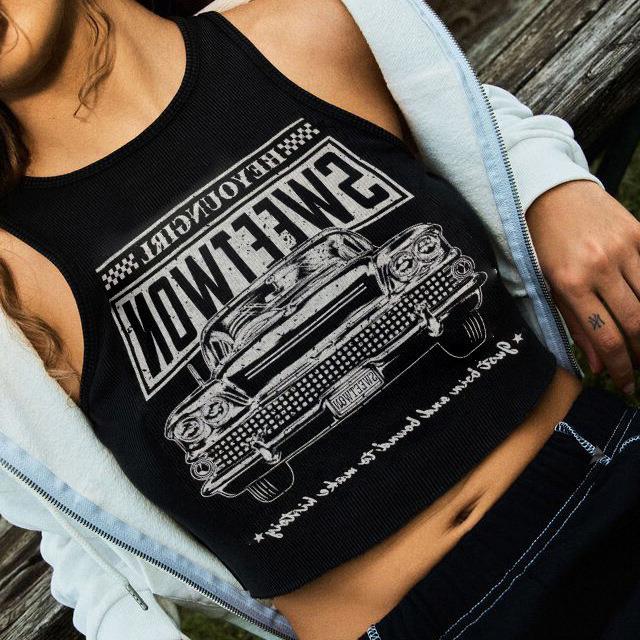 Trendy women's crop top with a unique car print, round neckline & short sleeves. Perfect for summer casual fashion.