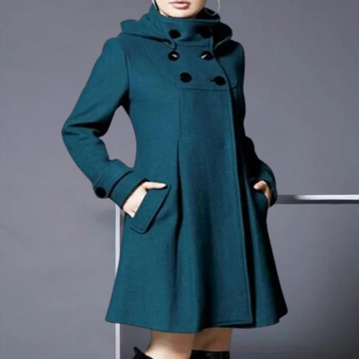 Stylish dark green women's jacket, the Medila, featuring practical side pockets. Elegant fall/winter outerwear.