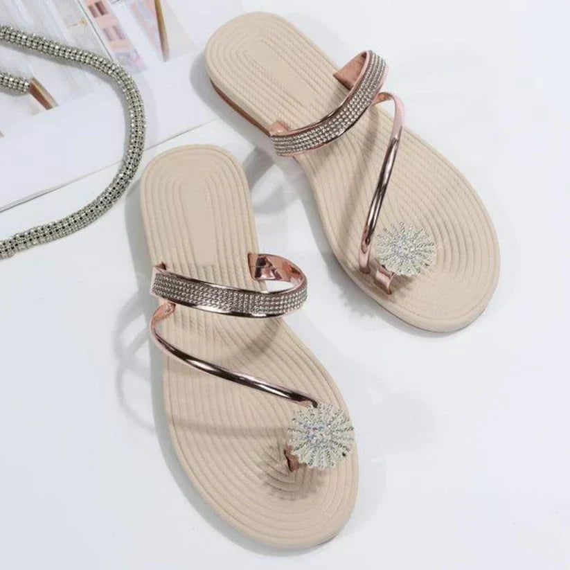 Fashionable women's open-toe sandals with a striking snowflake embellishment, great for any occasion.