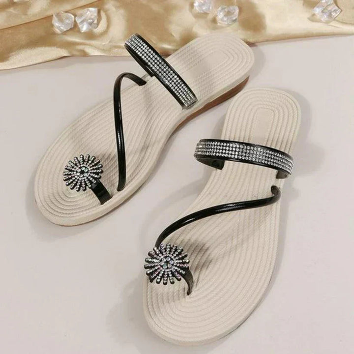 Elegant women's summer footwear, featuring a delicate snowflake detail, suitable for versatile styling.