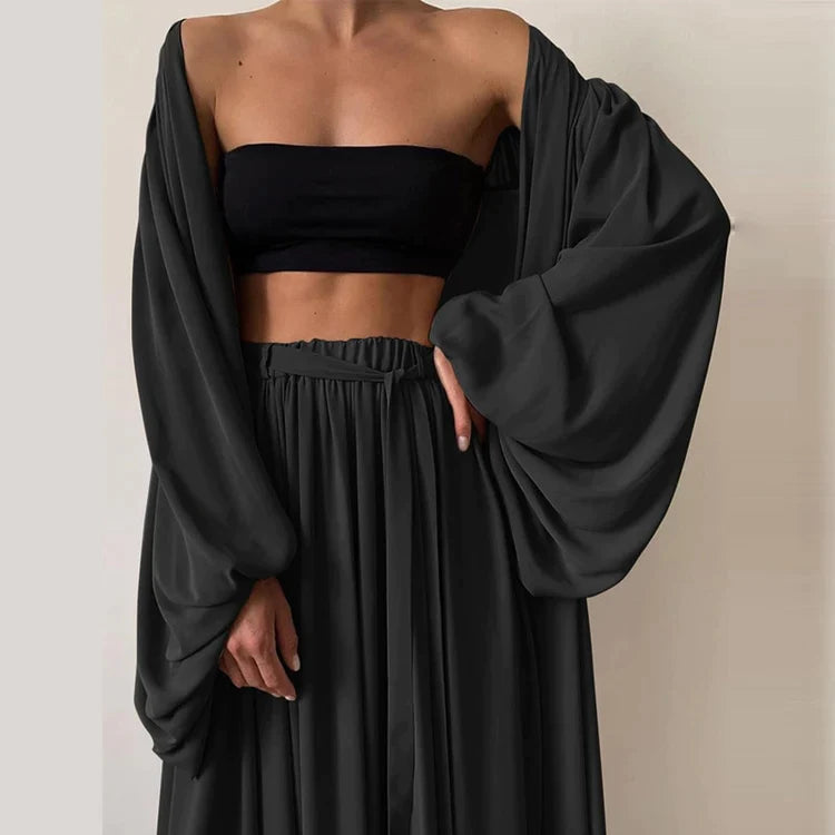 Trendy women's summer two-piece set: stylish top and comfortable trousers. Perfect for casual wear, vacation, or loungewear.