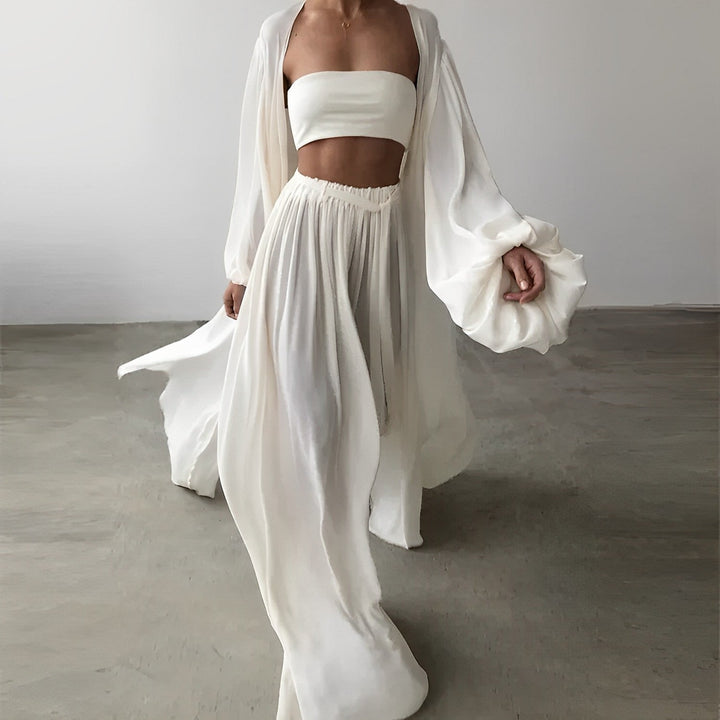 Chic women's matching summer outfit with a sleeveless top and comfortable wide-leg trousers. Ideal for trendy casual wear.