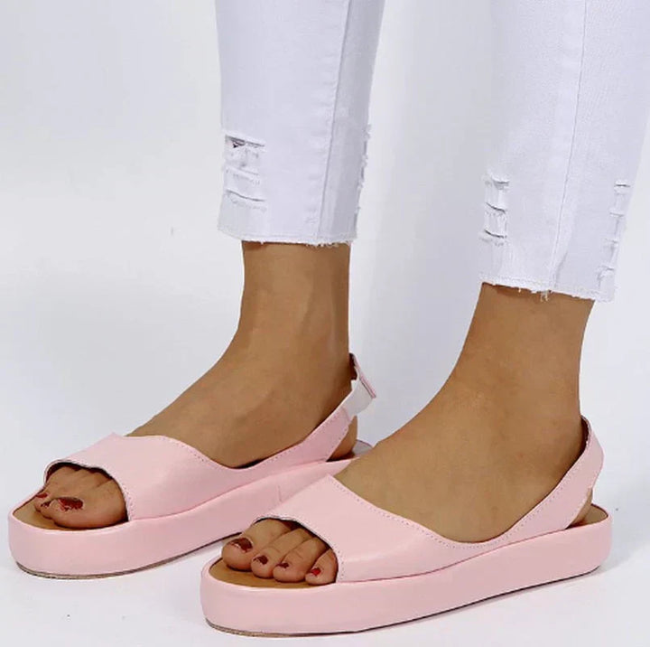 Modern women's slip-on sandals, perfect for versatile summer outfits. Comfortable, trendy & easy-to-wear footwear.