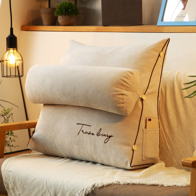 Soft triangular back support cushion, promoting relaxation & ergonomic home comfort.