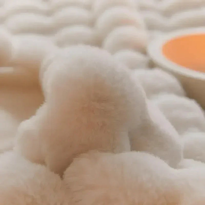 An all-season plush blanket in a neutral color, suitable for various home decor styles and warmth.