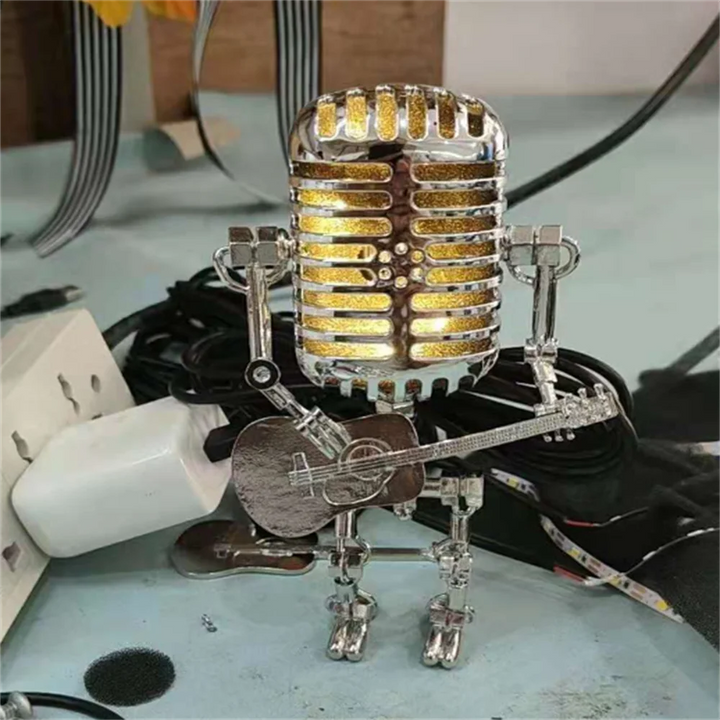 Novelty robot lamp featuring a microphone head & guitar, a cool unique gift for industrial decor lovers.
