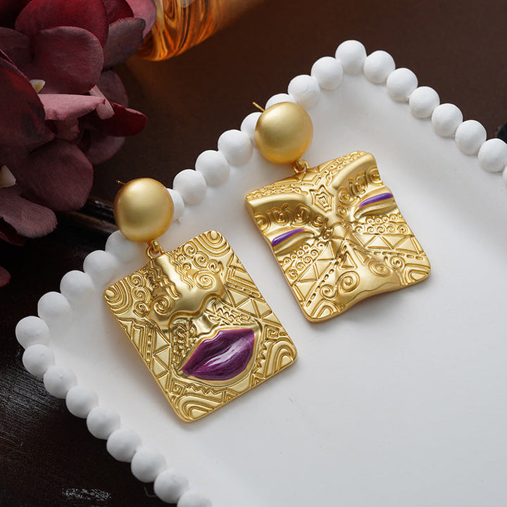 Eye-catching unique statement earrings for women, retro gold plated asymmetrical design.