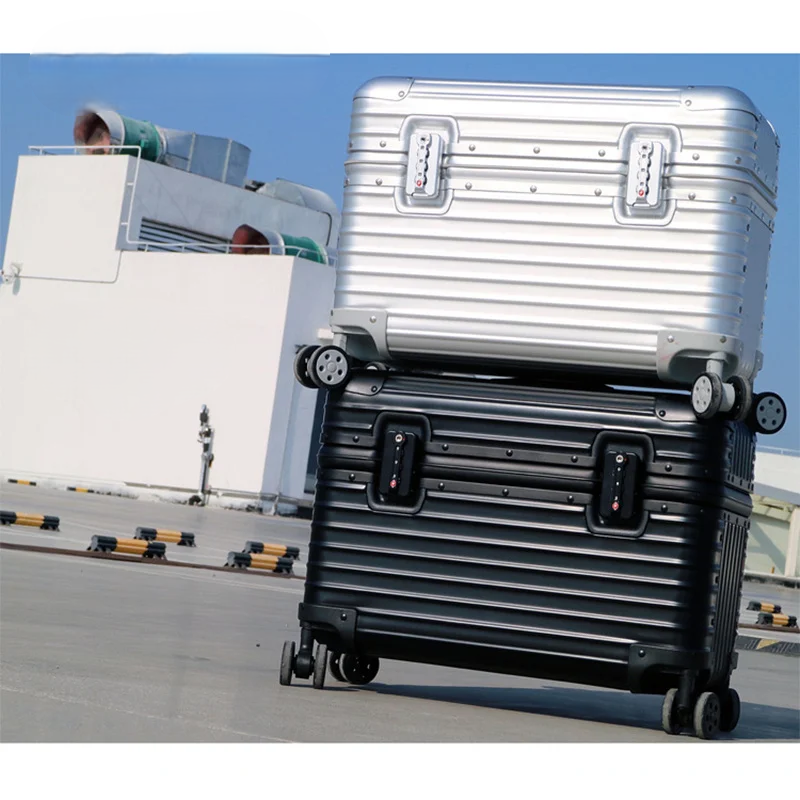 Unisex aluminum-magnesium hardshell suitcase, sleek silver design, perfect for business travel & vacations.