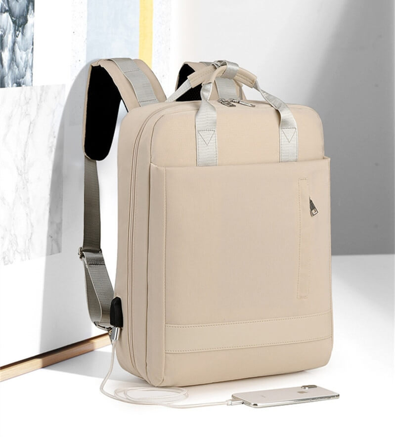 Grey anti-theft backpack, perfect for secure travel & daily commute, featuring hidden pockets.
