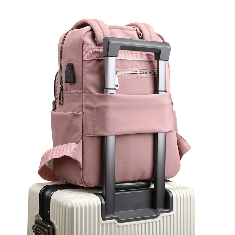 Unisex anti-theft backpack with USB charging port, water-resistant for travel & daily commute.