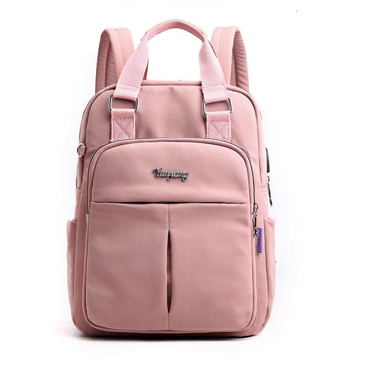 Traveler wearing the water-resistant anti-theft backpack at an airport, highlighting secure and hands-free travel.