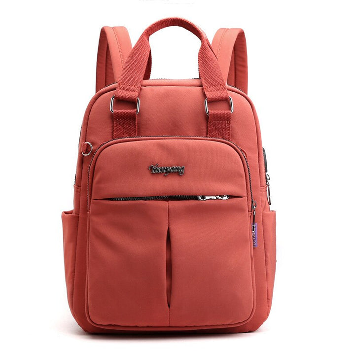 Secure zippers and anti-theft design features on the multi-compartment unisex travel backpack.