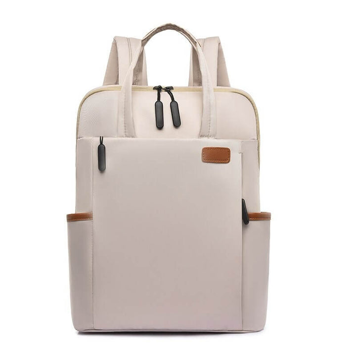 Unisex anti-theft Oxford travel backpack in black, showing main zipper entry, water resistant fabric.