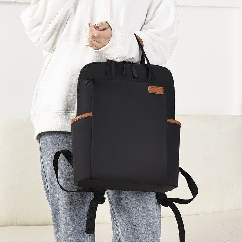 Backpack with a luggage strap, designed for easy attachment to suitcases, ideal for travel.