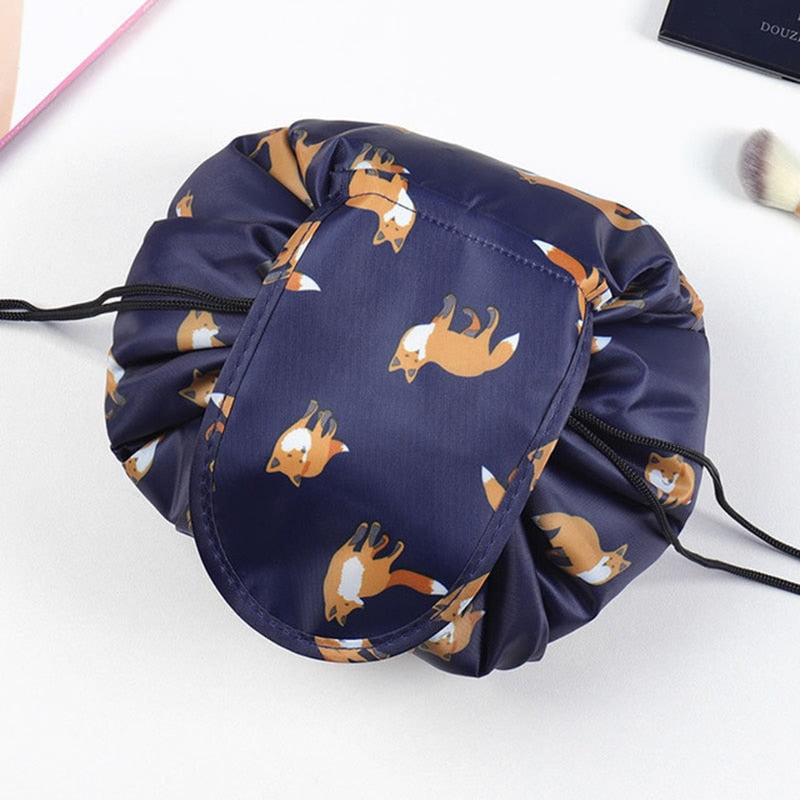 Hands holding an open drawstring cosmetic bag, showcasing ease of access to contents