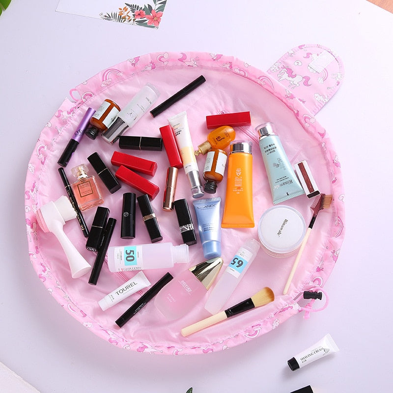 Compact drawstring makeup bag in a vibrant color, flattened, highlighting its portable design