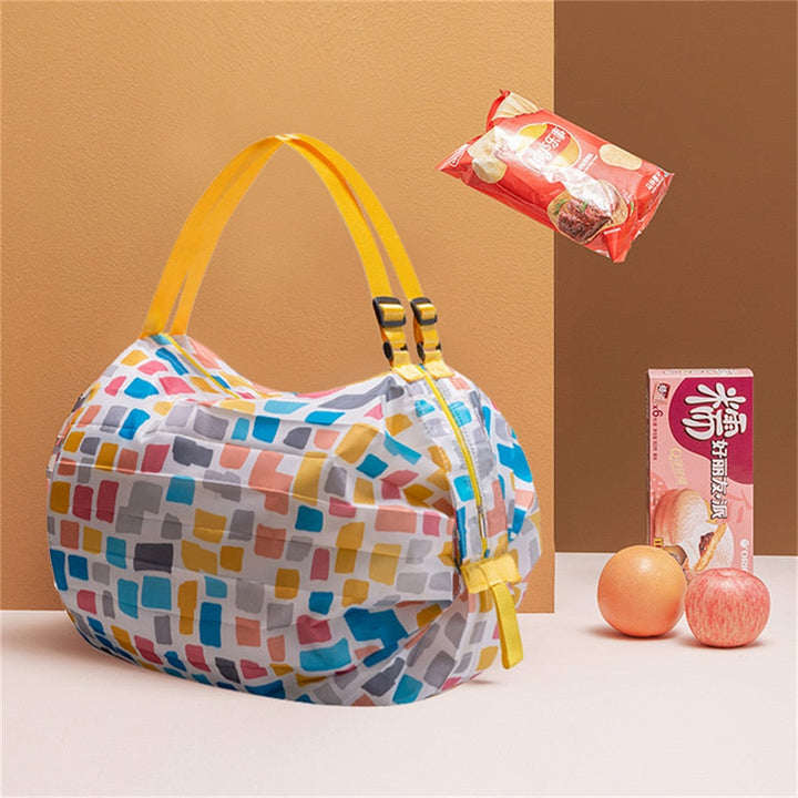 Eco-friendly foldable tote bag in a vibrant blue color, perfect for shopping, travel, and everyday use.