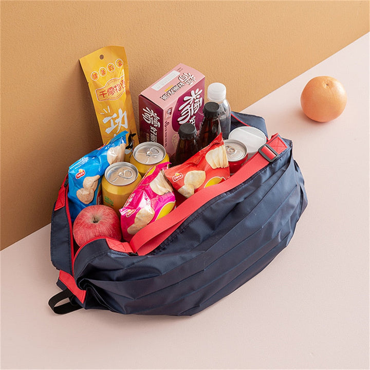 Compact and lightweight reusable shopping bag, shown folded for easy portability, made from strong oxford fabric.