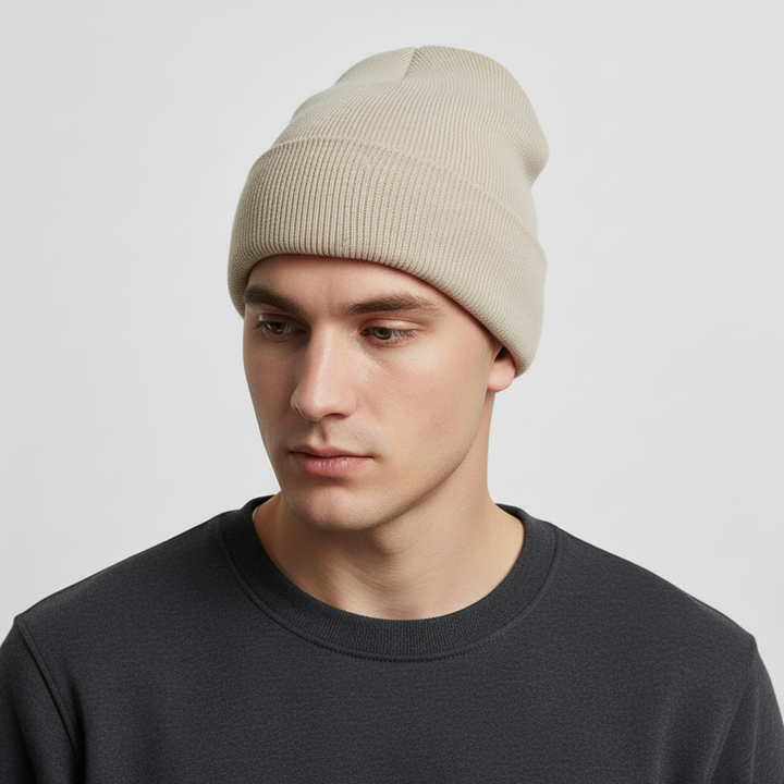 Side view of a green knitted acrylic beanie, 'FrostKnit' logo visible, warm unisex winter accessory.