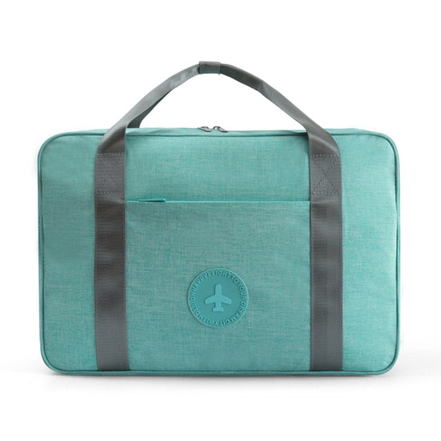 Spacious black duffle bag style carry-on, unisex and water-resistant for convenient travel