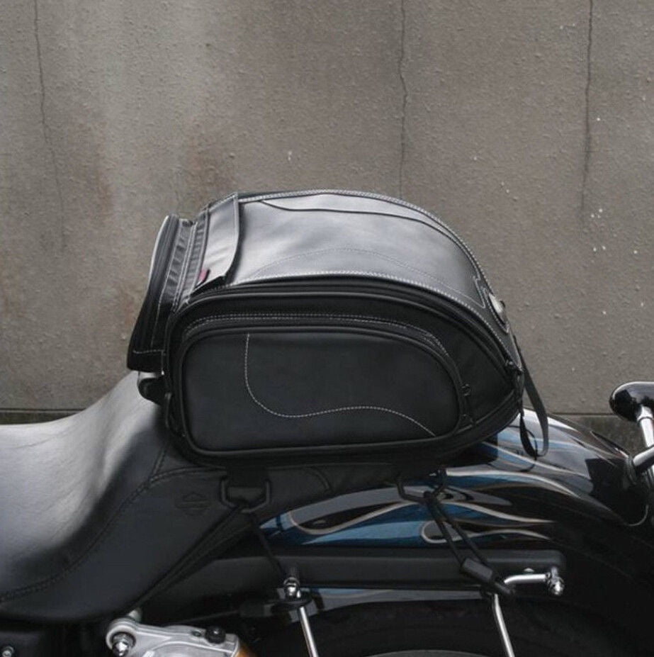 Motorcycle tail bag in expanded state, highlighting increased storage for rider accessory