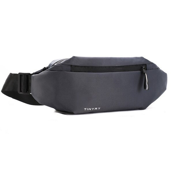 Detail view of the water-resistant zipper on a black multi-pocket fanny pack for secure accessory storage