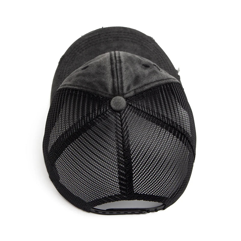 Close-up of black mesh ponytail cap showing breathable fabric & adjustable strap for custom fit.