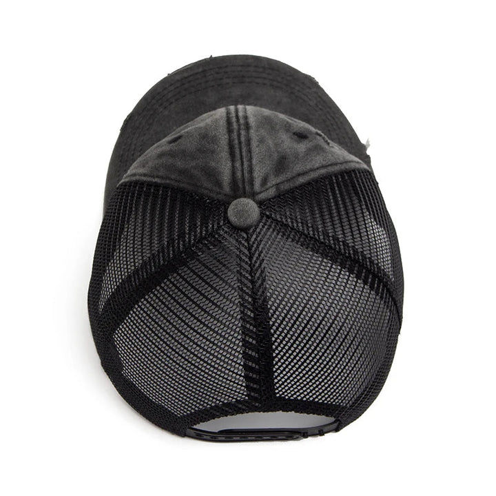 Close-up of black mesh ponytail cap showing breathable fabric & adjustable strap for custom fit.