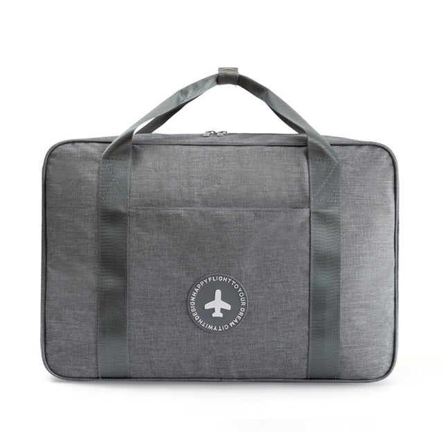 Durable unisex travel carry-on bag, designed for secure attachment over suitcase handles, perfect for organized travel.
