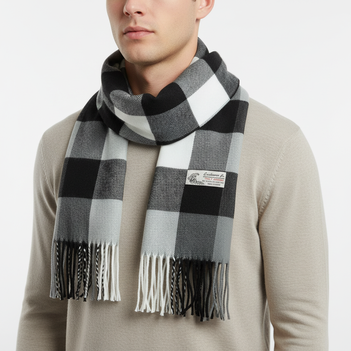 Overhead shot of a vibrant Stewart tartan cashmere-feel plaid scarf, showcasing its full pattern and soft material