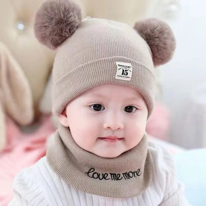 Toddler's red knitted winter hat, soft and warm with a fun pom-pom, a must-have accessory.