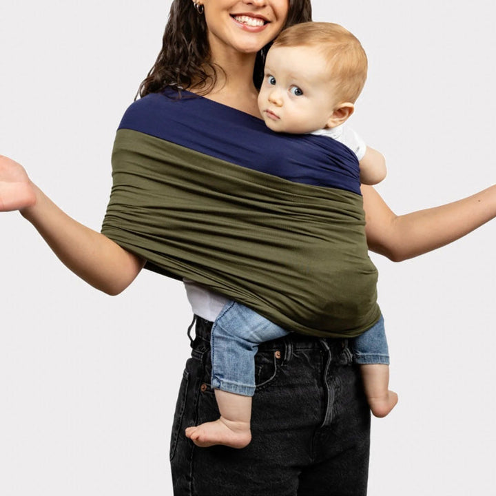 Soft fabric baby sling for hands-free infant care, ensuring comfort and closeness for parent & baby.