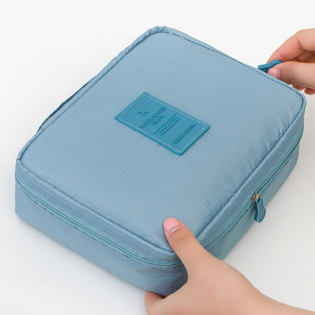 Portable waterproof beauty organizer, compact design for easy travel and cosmetic storage.