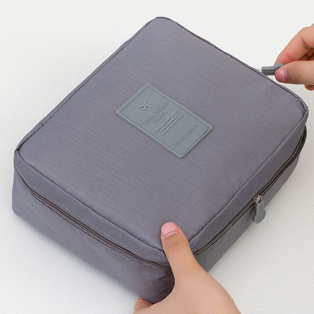 Waterproof makeup storage solution for travel, compact and unisex, keeps items protected.