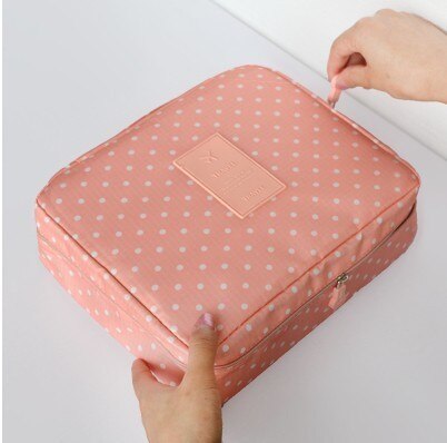 Compact cosmetic travel bag, unisex and waterproof, keeps makeup safe and organized.