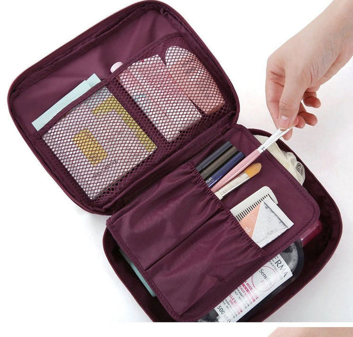 Travel-friendly waterproof makeup case, compact and portable, includes bonus mini case.