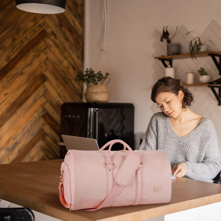 Compact carry-on duffel, features wrinkle-free suit storage for organized travelers.