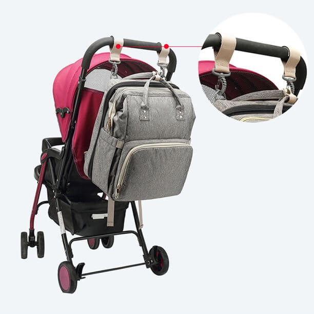 A parent carrying the multi-pocket nappy bag, displaying its modern, unisex design