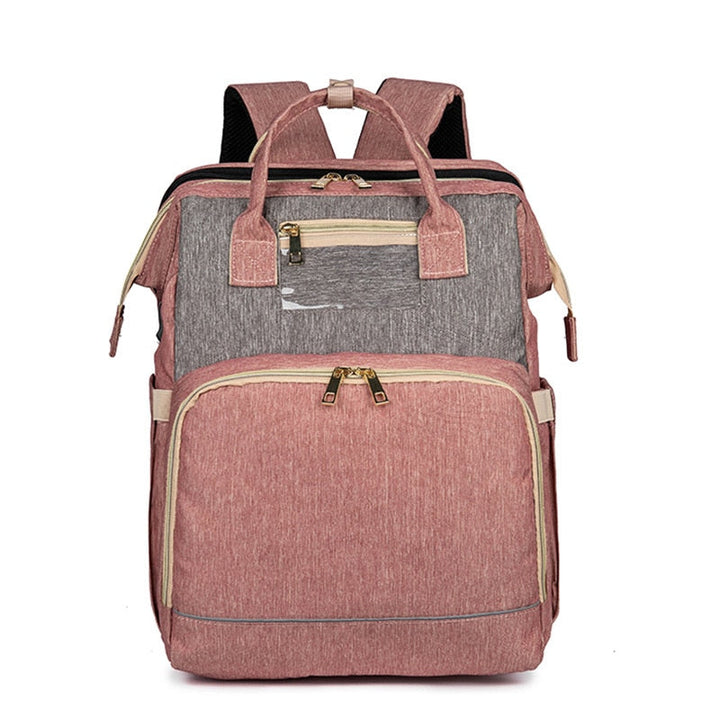 Close-up of the waterproof fabric and multi-pocket design on the convertible baby backpack