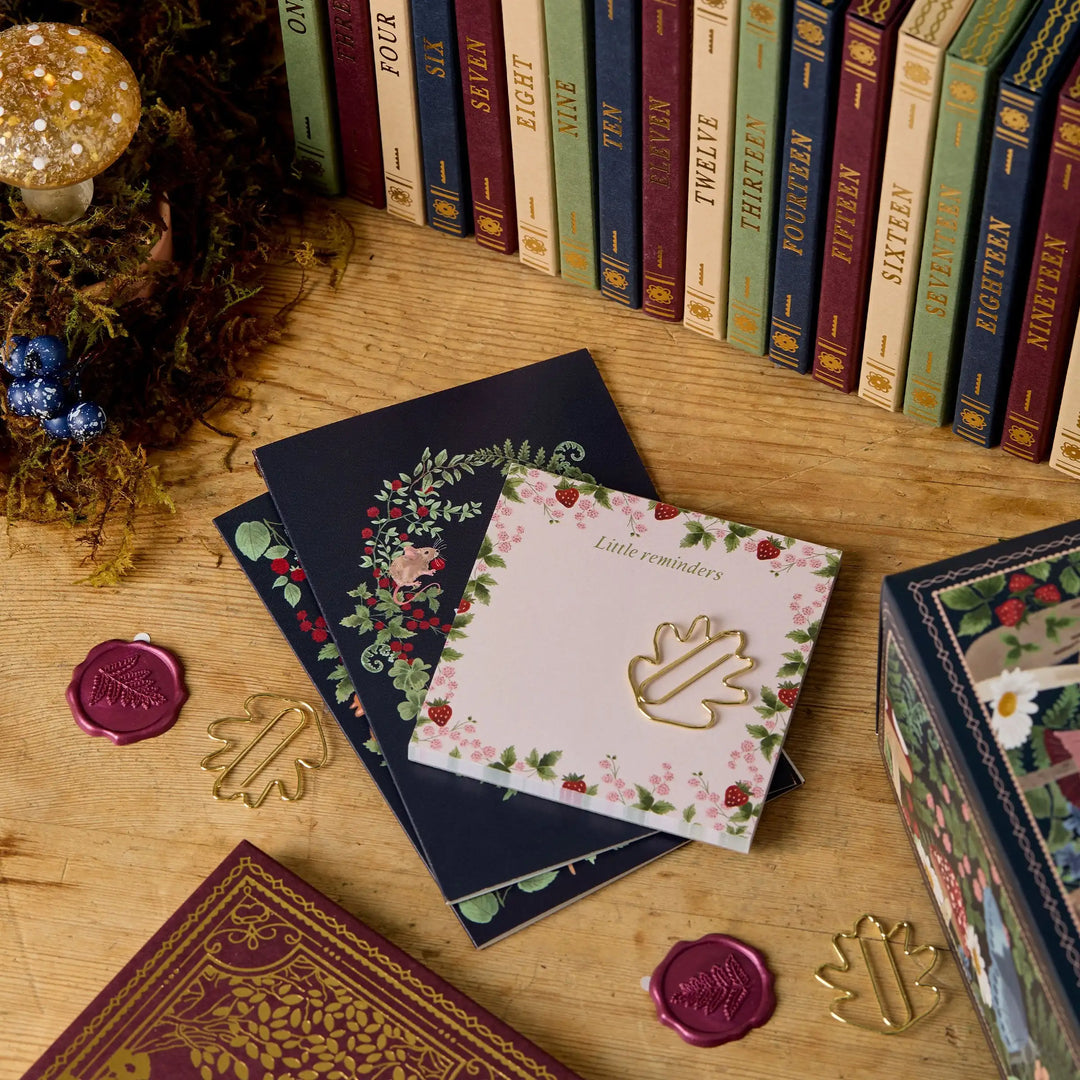 Top-down view of an open creative stationery advent calendar, displaying 24 different daily surprises