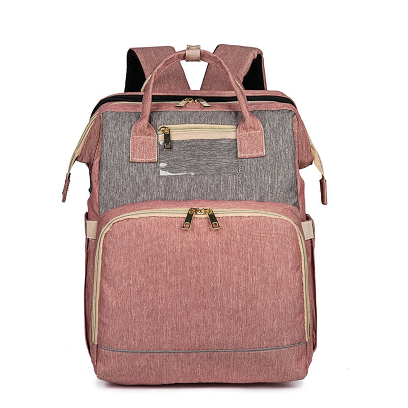 Diaper travel bag with sturdy straps attached to a stroller, offering convenient hands-free parenting.