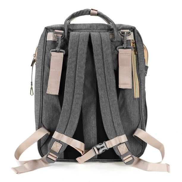 Side view of the diaper nappy backpack featuring easily accessible insulated pockets for baby bottles.