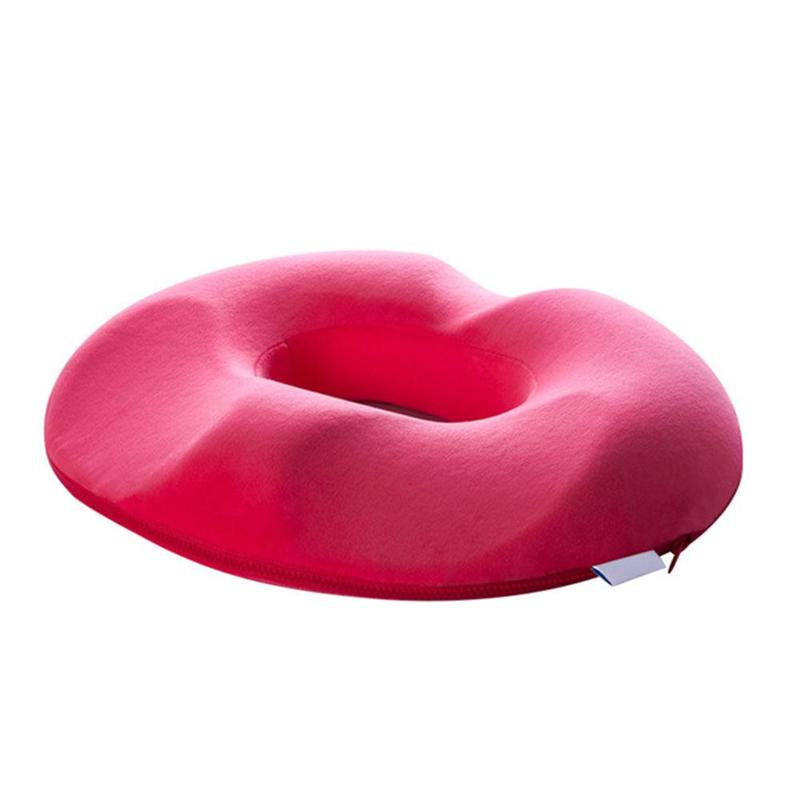 Unisex ergonomic donut cushion on an office chair, providing tailbone & posture support