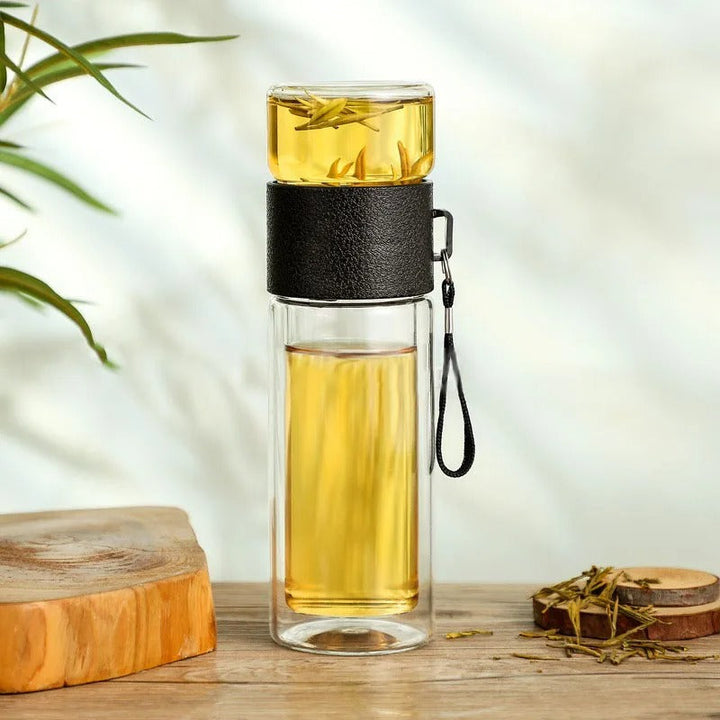 Stylish unisex insulated glass water bottle with built-in tea infuser for all your favorite beverages.