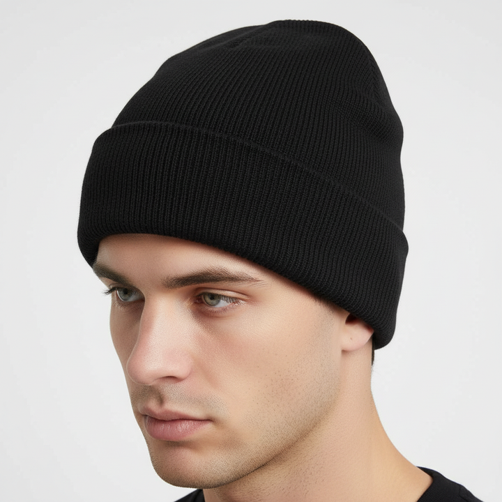 Side view of a red knitted winter beanie, highlighting its minimalist design and stretch fit.