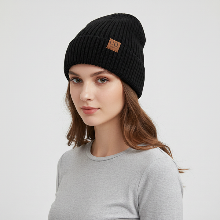 Knitted winter hat with a wide cuff, a versatile and warm accessory for men and women